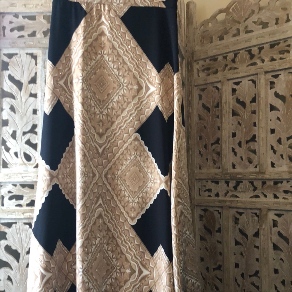 Black and tan medium women’s skirt. Waist 32” and length about 42” long .